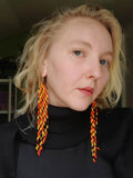 Load image into Gallery viewer, Orange Yellow and Black Tribal Seed Bead Earrings